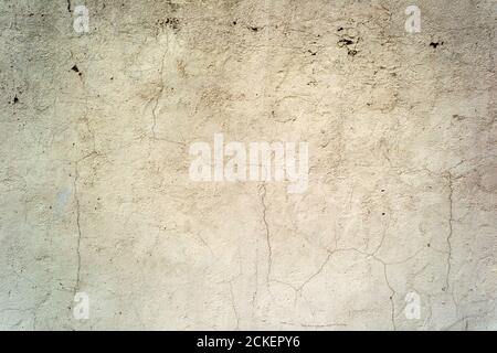 Cracked concrete painted wall background or texture. Close-up Stock Photo