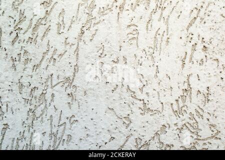 Empty dirty cracked white concrete wall texture or background Stock Photo