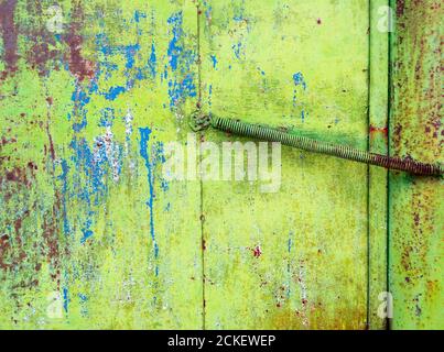 Rusty painted green metal with cracked paint. Texture grunge background Stock Photo