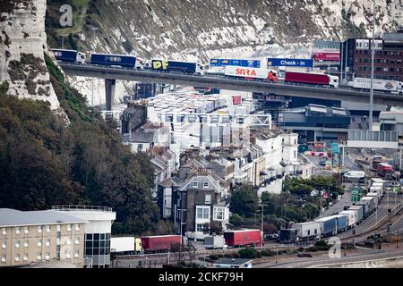 Lorries queue to enter the port in Dover, Kent, where an on-going police operation has caused long delays for vehicles. Stock Photo
