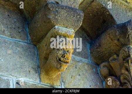 Ydes Bourg,  sculptures of Church Saint-Georges, Cantal department, Auvergne-Rhone-Alpes, France Stock Photo