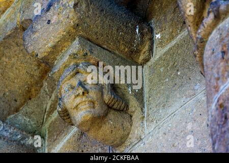 Ydes Bourg,  sculptures of Church Saint-Georges, Cantal department, Auvergne-Rhone-Alpes, France Stock Photo