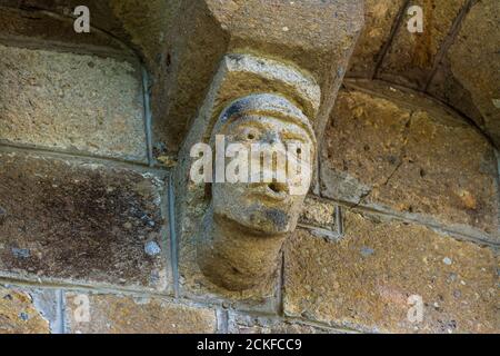 Ydes Bourg,  sculptures of Church Saint-Georges, Cantal department, Auvergne-Rhone-Alpes, France Stock Photo