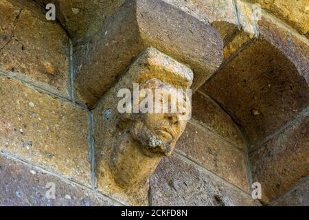 Ydes Bourg,  sculptures of Church Saint-Georges, Cantal department, Auvergne-Rhone-Alpes, France Stock Photo