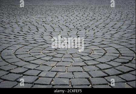 A perspective view of stone cobbles in a design of concentric circles. Stock Photo