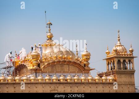 Amritsar, India - AUGUST 15: Cleaning service on the cupola of Golden Temple (Harmandir Sahib) on August 15, 2016, in Amritsar, Panjab, India. Stock Photo