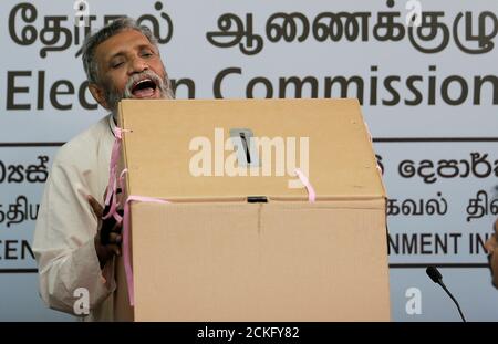 mahinda-deshapriya-chairman-of-the-elections-commission-of-sri-lanka-shows-a-ballot-box-during-a-news-conference-ahead-of-the-presidential-election-in-colombo-sri-lanka-october-31-2019-reutersdinuka-liyanawatte-2ckfy82.jpg