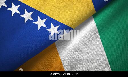 Bosnia and Herzegovina and Cote d'Ivoire Ivory coast two flags textile Stock Photo
