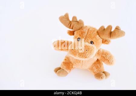 Children Toy collection, Soft brown deer on a white background. soft christmas toy brown deer. Stock Photo