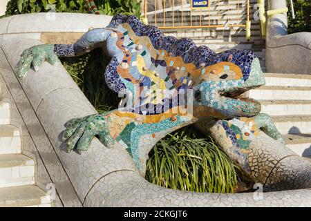 Trencadís mosaic salamander statue on the main staircase in the Park Güell designed by Catalan modernist architect Antoni Gaudí and built between 1900 and 1914 in Barcelona, Catalonia, Spain. Stock Photo