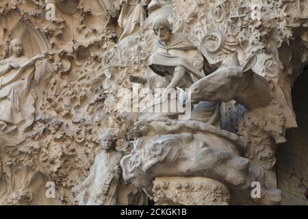 Nativity scene depicted on the Nativity facade of the Sagrada Família (Basílica de la Sagrada Família) designed by Catalan modernist architect Antoni Gaudí in Barcelona, Catalonia, Spain. The Nativity facade was designed by Antoni Gaudí himself and constructed between 1894 and 1930. The statues were carved by Catalan modernist sculptor Llorenç Matamala i Piñol. Stock Photo