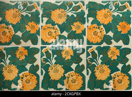 Yellow marigolds depicted in the glazed tiles on the main facade of the Casa Vicens designed by Catalan modernist architect Antoni Gaudí in Barcelona, Catalonia, Spain. The mansion commissioned by Catalan industrial tycoon Manuel Vicens as his family summer residence was built between 1883 and 1885. Stock Photo