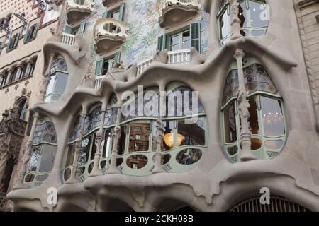 Trencadís mosaic facade of the Casa Batlló in Barcelona, Catalonia, Spain. The mansion designed by Catalan modernist architect Antoni Gaudí for the Batlló family as a revenue house as well as a private family residence built was between 1904 and 1906. Stock Photo