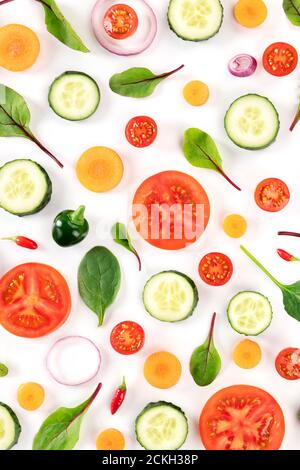 Fresh summer vegetables, a flat lay on a white background, vibrant food pattern, shot from the top Stock Photo