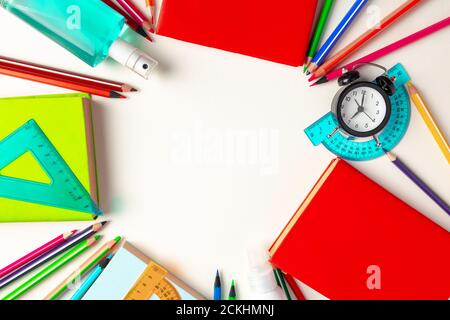 It's time to get back to school. Stationery and alarm clock Stock Photo