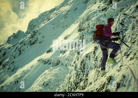 climber traversing the Aonach Eagach in Glen Coe, Scotland, UK. Stock Photo
