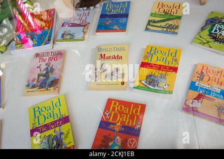 Roald Dahl book covers in a charity shop window, London, U.K.