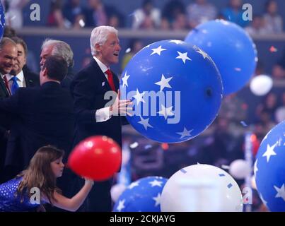 Former president Bill Clinton enjoys the balloon drop after his wife Democratic presidential nominee Hillary Clinton accepted the nomination on the fourth and final night at the Democratic National Convention in Philadelphia, Pennsylvania, U.S. July 28, 2016.  REUTERS/Lucy Nicholson