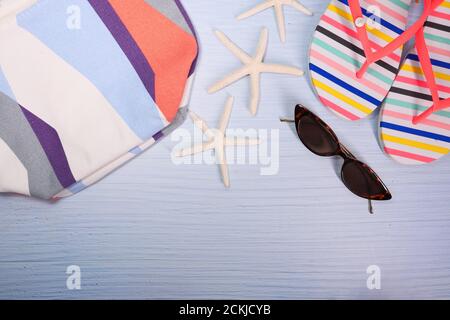 flat composition of summer beach accessories on table. Stock Photo