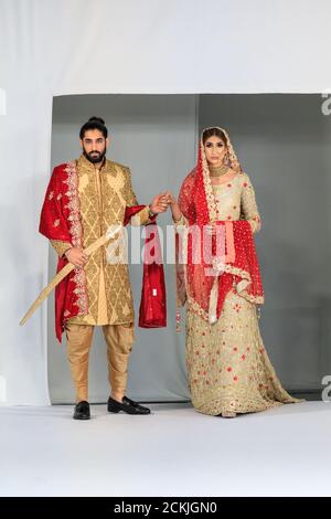 Model bride and groom Asian wedding dress bridal wear gown by Sache by Asif National Asian Wedding Show fashion runway London Stock Photo Alamy