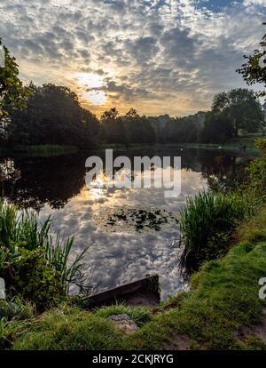 Reflections on Tong Park Dam, Baildon, Yorkshire, England. Stock Photo