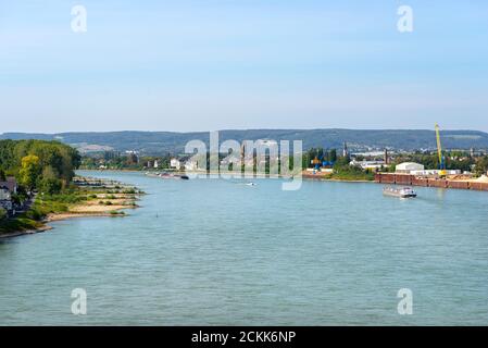 A large tanker ship sailing in Germany on the Rhine River. Transportation of oil, gas and gasoline, visible loading port, heavy sea traffic. Stock Photo