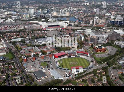 aerial view of the Old Trafford Cricket Ground looking north up Brian Statham Way to Manchester United's Old Trafford Ground & beyond to Salford Quays Stock Photo