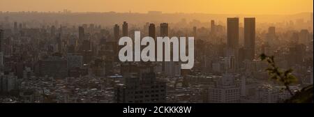 View from above, stunning sunset over the Taipei City skyline. Panoramic view from the Mount Elephant in Taipei, Taiwan. Stock Photo