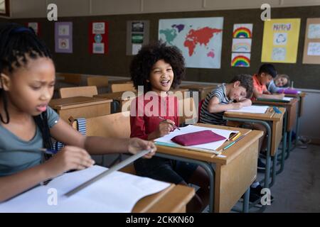Group of kids studying in the class Stock Photo