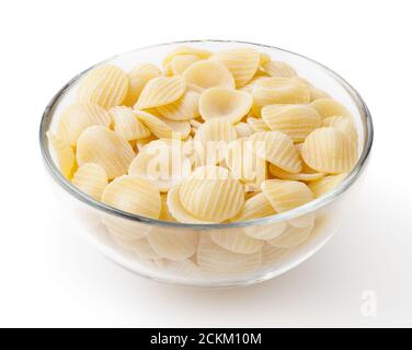 Uncooked orecchiette pasta in glass bowl isolated on white background with clipping path Stock Photo