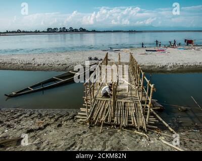 A wooden bridge across the Brahmaputra river Stock Photo