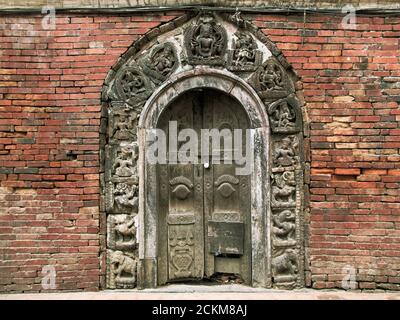 Ornate carvings on a doorway in Patan in Nepal Stock Photo