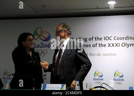 Nawal El Moutawakel (L), chairman of the International Olympic Committee (IOC) Coordination Commission and Rio 2016 Olympic Games Organising Committee President Carlos Arthur Nuzman shake hands after a news conference during the IOC Coordination Commission's 10th visit to Rio de Janeiro, Brazil, April 13, 2016. REUTERS/Pilar Olivares