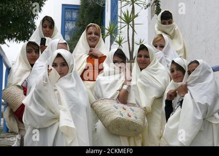 Tunisian Muslim Women in traditional Tunisia clothes in the Old Town of Sidi Bou Said near the City of Tunis in north of Tunisia in North Africa,  Tun Stock Photo