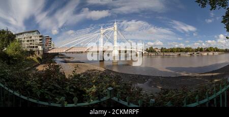 View towards Albert Bridge from the Thames river walk, Battersea, Greater London, United Kingdom, Europe Stock Photo