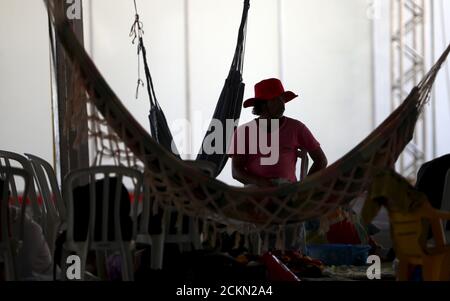 A member of the Landless Workers Movement (MST) is seen in a tent at the camp, ahead of the impeachment process vote of Brazil's President Dilma Rousseff in the lower house in Brasilia, Brazil, April 15, 2016. REUTERS/Adriano Machado