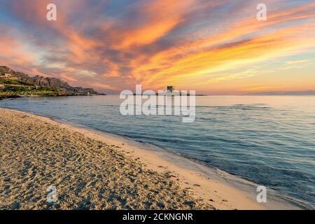 Sunrise on the beach of La Pelosa, in the small city of Stintino, with dramatic cloudy sky of summer Stock Photo