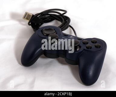 Game controller with USB connector on white background Stock Photo