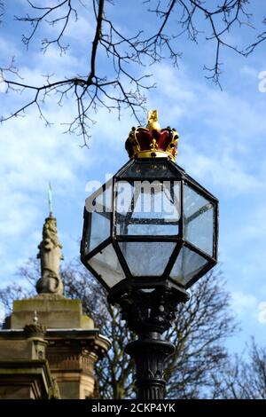 close up of regal ornate lamplight. Decorative glass Victorian street light outside in spring Stock Photo