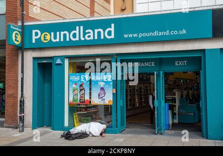 Uxbridge, London Borough of Hillingdon, UK. 11th September, 2020. A homeless man sleeps on the concrete outside the Poundland shop in Uxbridge during the Covid-19 lockdown. Credit: Maureen McLean/Alamy Stock Photo