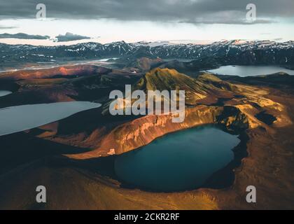 Aerial view of Hnausapollur Crater Lake in the Highlands of Iceland during the golden hour and sunset. Beautiful summer in Iceland. Tourism in the Stock Photo