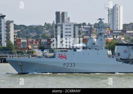 HMS Tamar, a Batch 2 River-class offshore patrol vessel of the Royal Navy, heads down the River Thames after paying its first visit to London Stock Photo