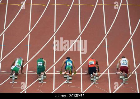 Beijing, China  September 13, 2008: Day 8 of athletic competition at the Beijing 2008 Paralympic Games shows (l to r), Joseph Godwin Mbakara of Nigeria, David Roos of South Africa, Yohansson Nascimento of Brazil, Domingos Sebastio of Angola and Rubeng Gomez of Venezuela in the T46 men's 100-meter trials. ©Bob Daemmrich Stock Photo
