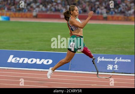 Beijing, China  September 12, 2008: Day six of athletic competition at the 2008 Paralympic Games showing Mexico's Perla Bustamante (1797) winning the T42 women's 100-meters at the Paralympics, with a world record in 16.32 seconds. ©Bob Daemmrich Stock Photo