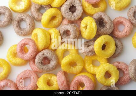 Background of colorful cereal rings on white background Stock Photo