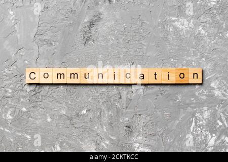 COMMUNICATION word written on wood block. COMMUNICATION text on cement table for your desing, concept. Stock Photo