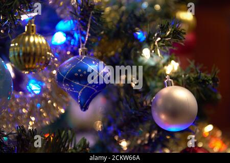 Christmas Tree Ornaments and Lights. Selective focus shot of decorations on a Christmas tree. Stock Photo