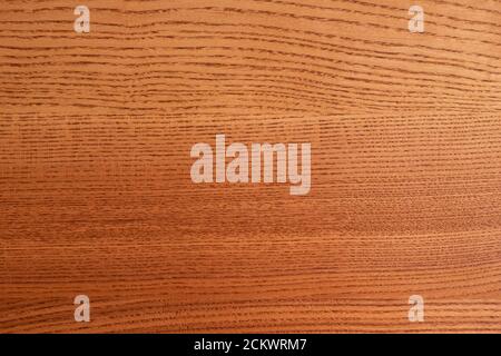 The structure of natural ash wood, tinted oak. Hardwood. Creative vintage background. Imitation of aging. Stock Photo