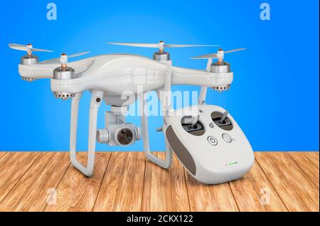 Drone quadrocopter with remote control on the wooden table. 3D rendering Stock Photo