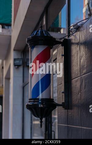 Closeup of a barber's pole, the traditional sign used by barbers Stock Photo